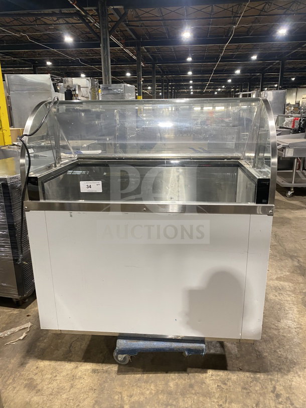 Commercial 46" white curved glass ice cream/frozen yogurt cabinet with rear lift-open access, ideal for businesses.