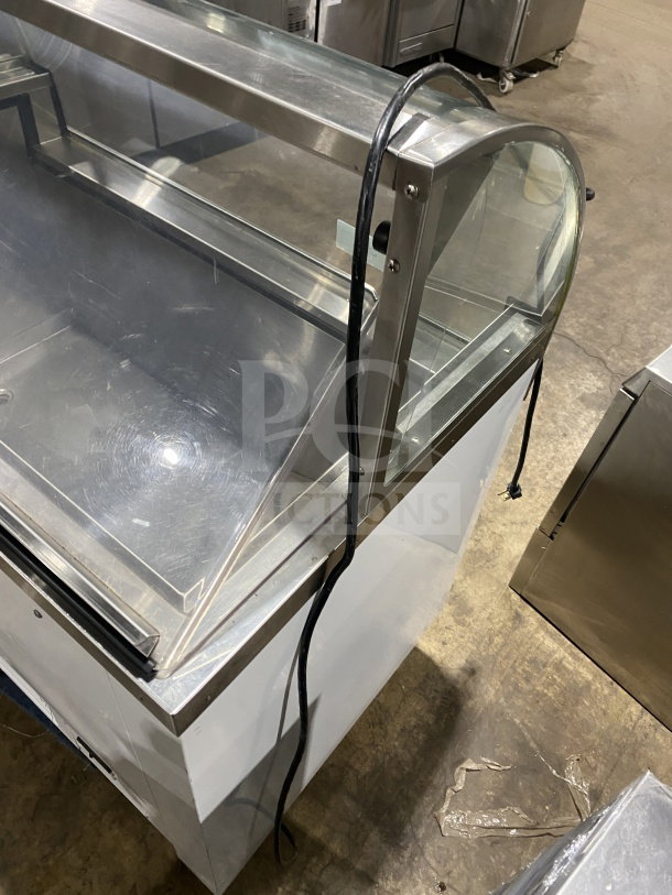 Commercial 46" white curved glass ice cream/frozen yogurt dipping cabinet with rear lift-open access, in good condition.