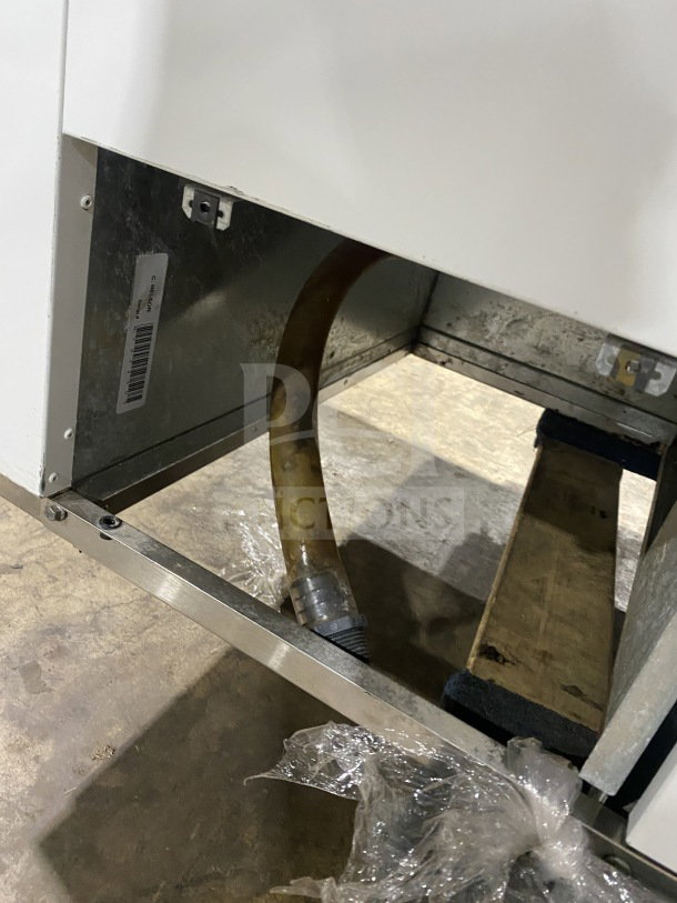 Commercial white curved glass 46" ice cream/frozen yogurt dipping cabinet. Features rear lift-open access, sturdy build.