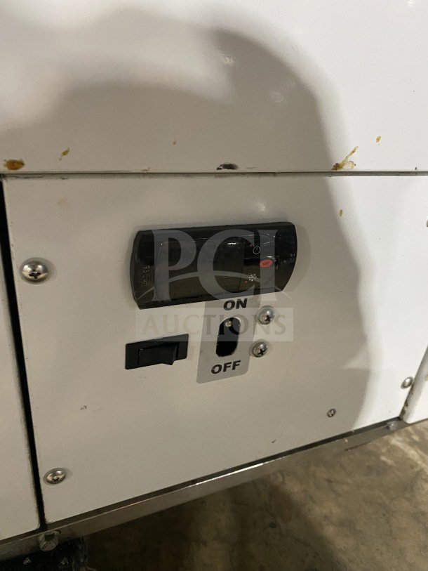 White commercial 46" ice cream cabinet with curved glass, rear lift-open access. Features visible on/off switch and temperature control.