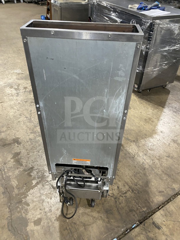 Pitco Model SFSG14JS commercial stainless steel 40 lb. deep fryer; natural gas; with filtration system and casters.