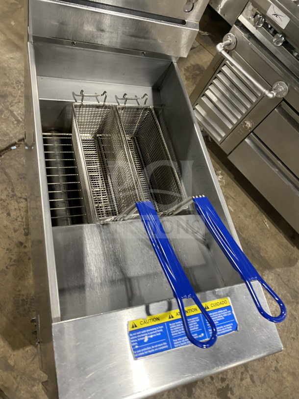 Pitco SFSG14JS 40 lb. commercial deep fryer, stainless steel, natural gas, filtration system, basket hanger, blue handles.