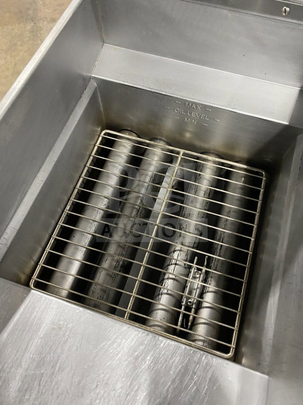 Pitco SFSG14JS 40 lb. commercial stainless steel deep fryer, natural gas, with filtration, backsplash, basket hanger.