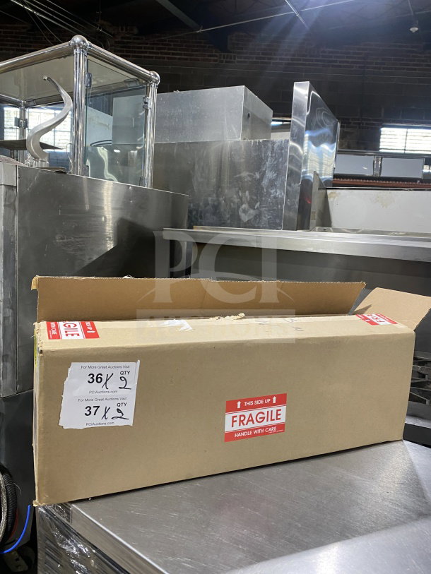 Brand new Vollrath stainless steel single-slot countertop cup dispenser cabinet, Model 58821A, in original box labeled "Fragile."