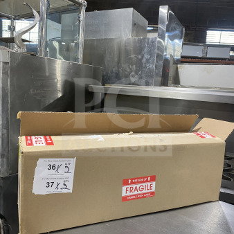 Brand new Vollrath stainless steel single-slot countertop cup dispenser cabinet, Model 58821A, in original box labeled "Fragile."