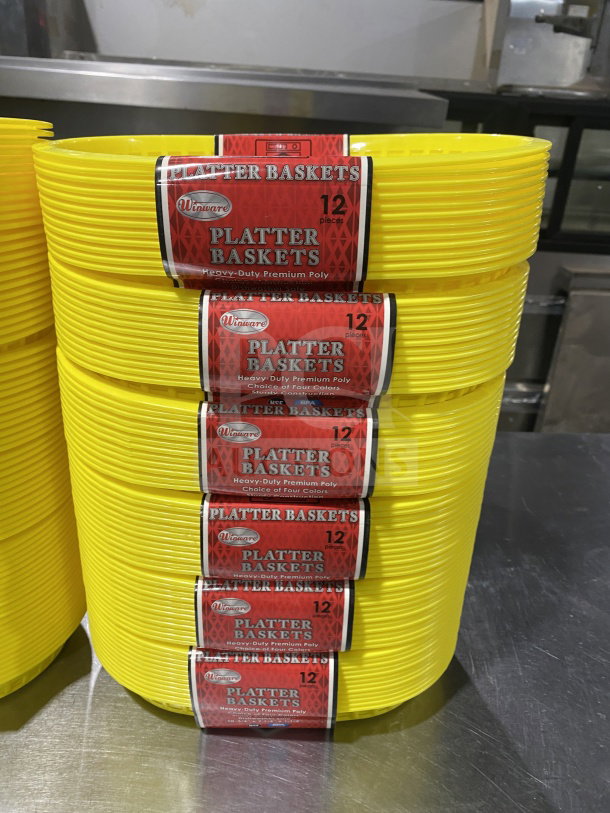 Brand new WincoWinwar Yellow Oval Fast Food Serving Baskets, Model PLBY, bundled in dozens, featuring durable poly construction.