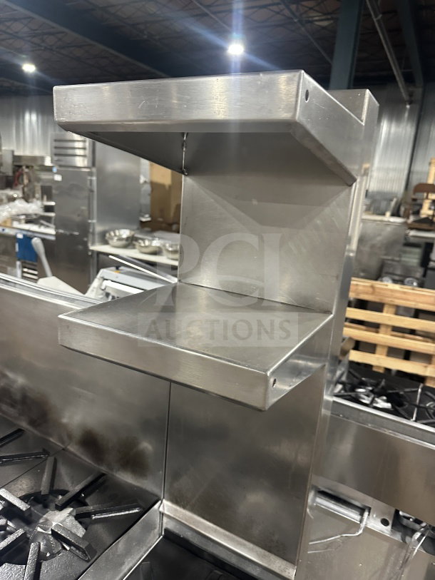 Jade Range stainless steel commercial 8-burner natural gas range, model TRLH02ST48, with chef base, backsplash, and flue riser.