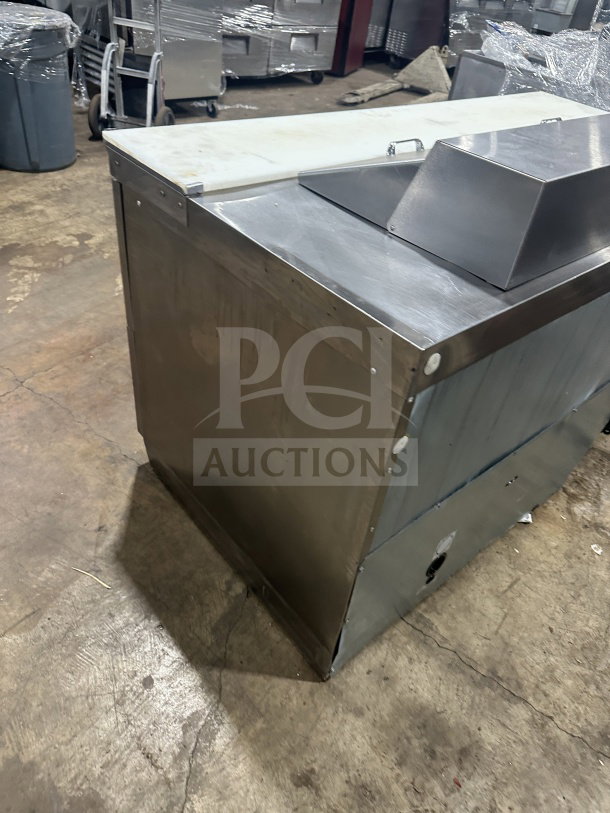Delfield Manitowoc stainless steel 4-drawer mega top refrigerated sandwich prep table, Model UCD4464N12DD5, in good condition.