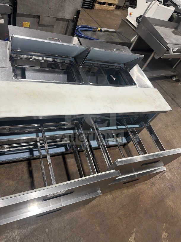 Delfield Manitowoc stainless steel 4-drawer refrigerated prep table, model UCD4464N12DD5, with mega top, in good condition.