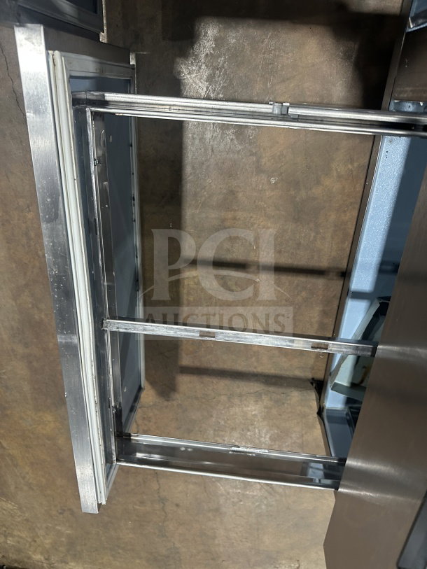 Delfield Manitowoc stainless steel 4-drawer refrigerated prep table, Model UCD4464N12DD5, open drawer view, commercial use.