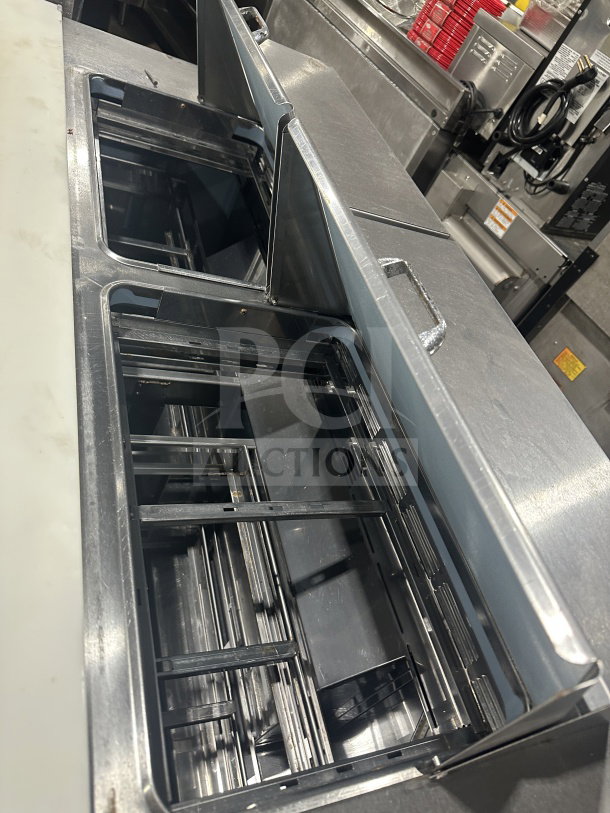 Delfield Manitowoc stainless steel 4-drawer refrigerated sandwich prep table, Model UCD4464N-12-DD5, in good condition.