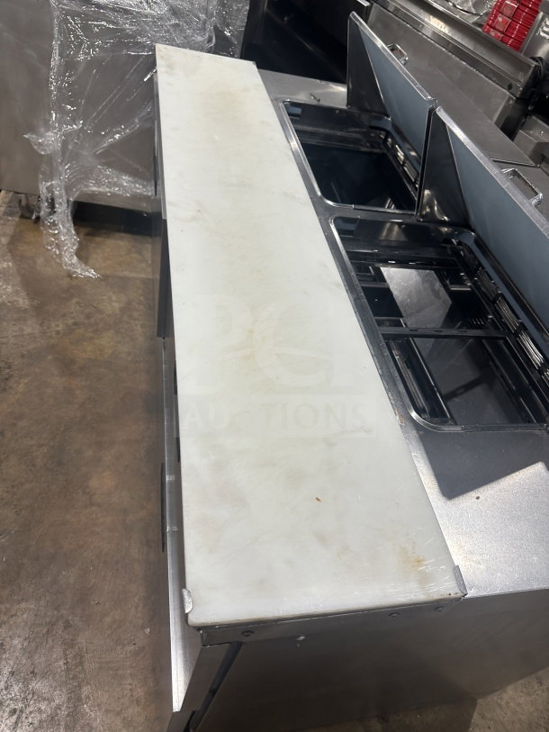 Delfield Manitowoc stainless steel 4-drawer sandwich prep table, model UCD4464N-12-DD5, features mega top and cutting board.