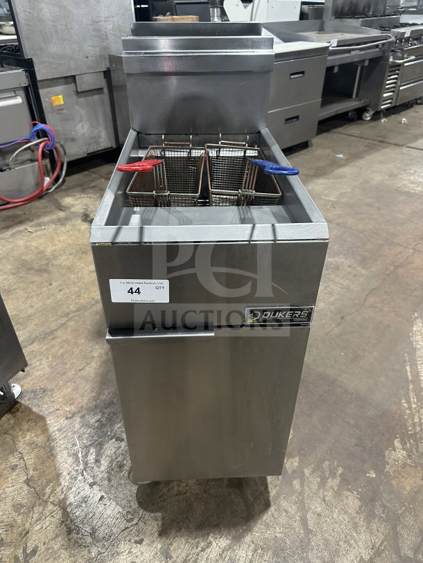 Dukers DCF3NG stainless steel deep fat fryer, natural gas, 40 lb capacity, 3 tube burners, basket hanger, on casters.