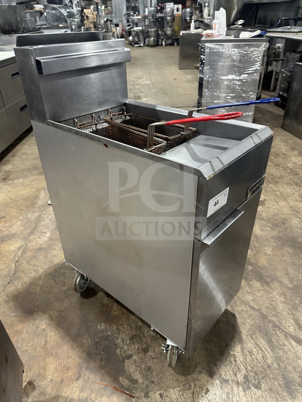 Dukers DCF3NG stainless steel natural gas fryer, 40 lb. capacity, 3 tube burners, basket hanger, on casters.