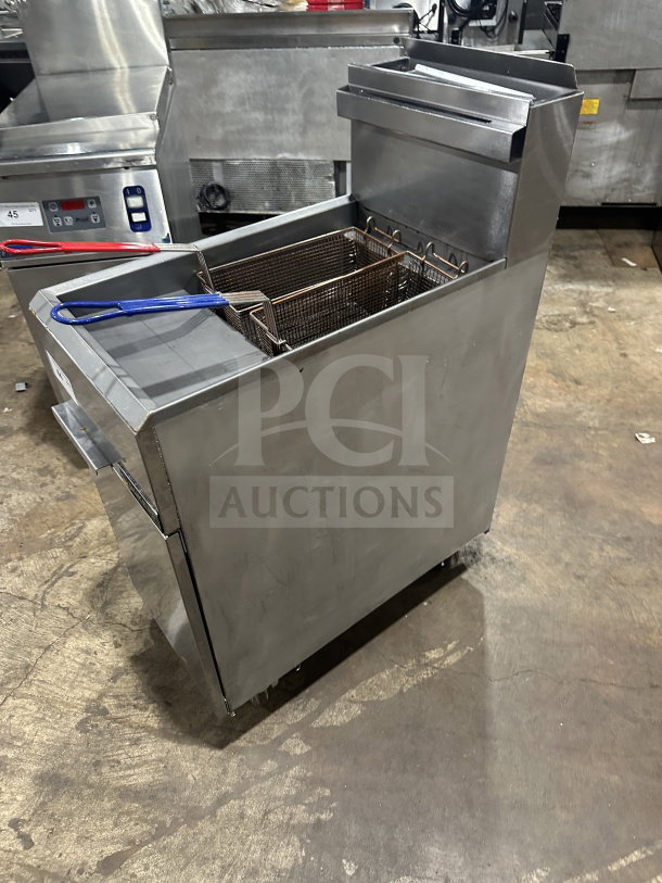 Dukers stainless steel natural gas fryer, model DCF3-NG, with 3 tube burners, basket, backsplash, and on casters.
