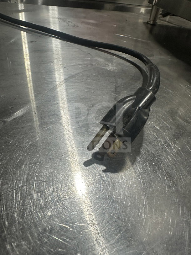 Belleco JT2H electric conveyor toaster plug on a stainless steel surface, 120V, single phase, serial 1512-4368305.