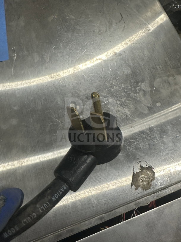 Turbo Chef Encore 2 electric rapid cook oven plug on stainless surface, 208/240V, visible model details.