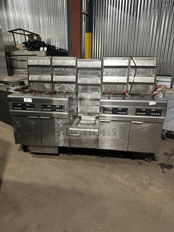 Frymaster commercial stainless steel 4-bay fryer system, model FMPH455SC, with digital controls, fry basket, and oil filter.