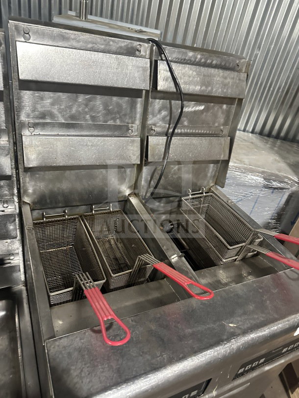 Frymaster FMPH455SC stainless steel 4-bay 50 lb deep fryer, natural gas, with center dump, digital control, oil filter, on casters.