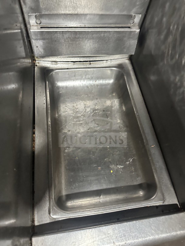 Frymaster FMPH455SC stainless steel 4-bay fryer system. Includes center dump station, basket hangers, digital control, and oil filter.