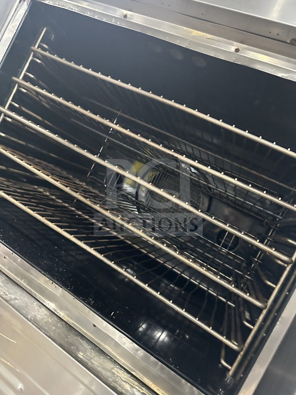 Blodgett stainless steel double convection oven with wire racks, gas-powered, Energy Star certified, on legs.