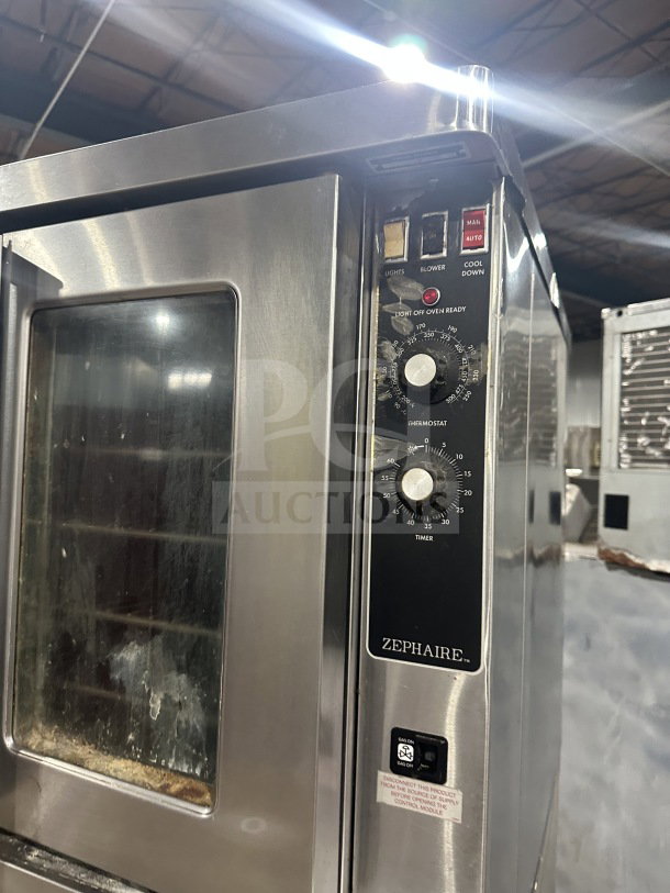 Blodgett stainless steel gas convection oven, double stacked, Energy Star certified, with wired rack and control panel, on legs.