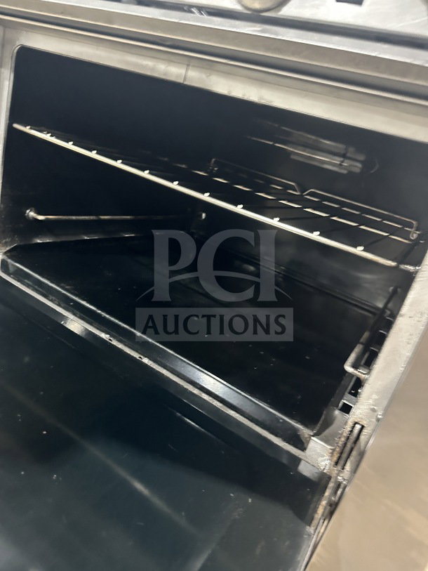 Southbend S36D7N commercial stainless steel range/oven interior with wired oven rack, clean condition, model S36D7N.