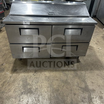 True commercial stainless steel refrigerated sandwich prep table, model TSSU6016D2, with 4 drawers, on casters.