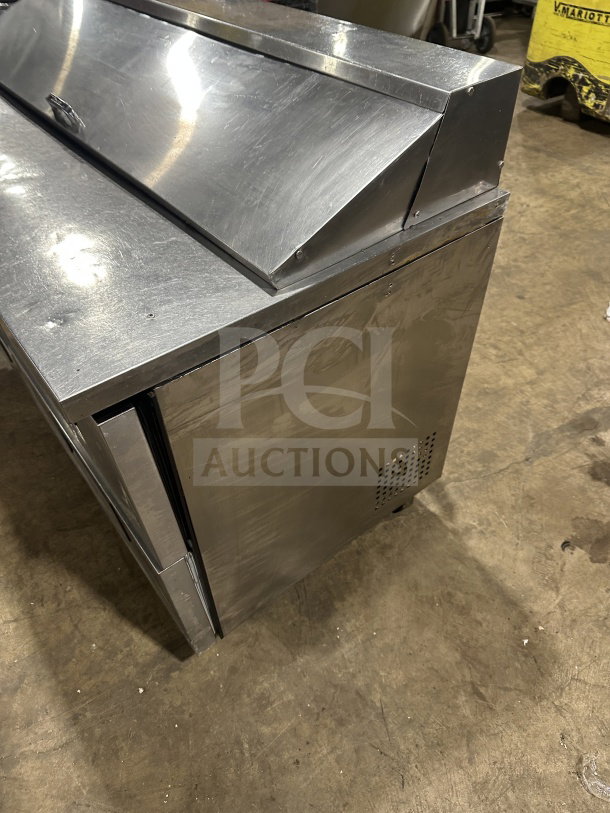 True TSSU6016D2 stainless steel refrigerated sandwich prep table, 4 drawers, on casters, good condition, 115V, 1 phase.