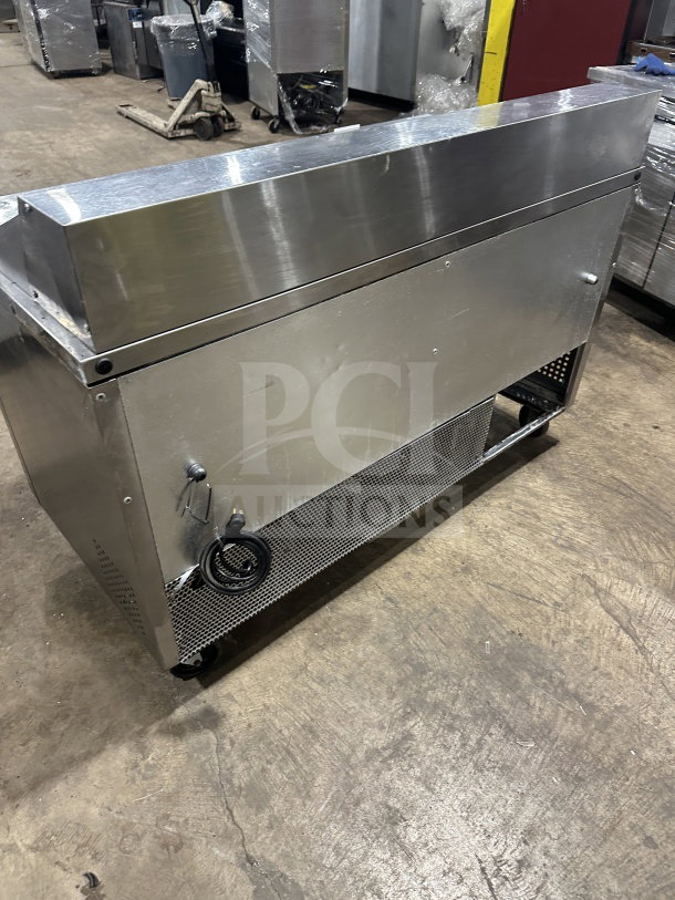 True commercial stainless steel refrigerated sandwich prep table on casters, Model TSSU6016D2, with 4 drawers, 115V, 1 Phase.