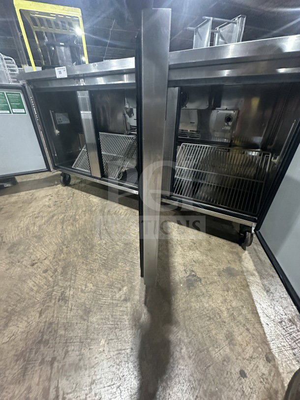 Turbo Air MUR72 commercial stainless steel 3-door undercounter refrigerator with poly coated racks, 115V, on casters.