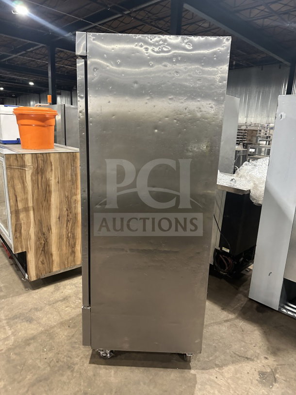 Fagor stainless steel reach-in refrigerator, single solid door, poly-coated wire rack, 115V, on casters, good condition.