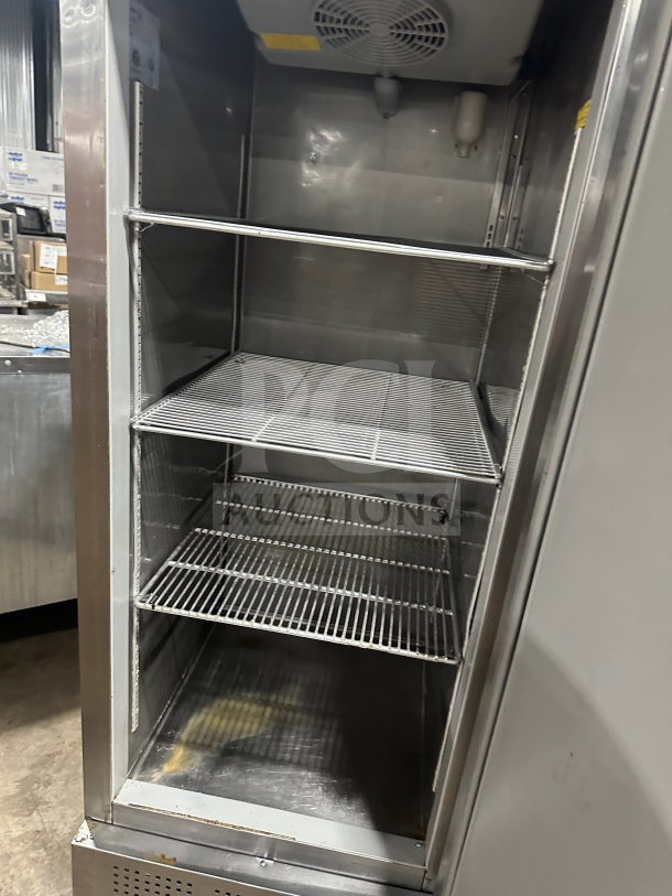 Fagor stainless steel reach-in refrigerator with single solid door, poly coated wire rack, 115V, on casters, good condition.