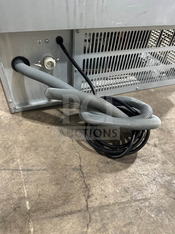 Avantco commercial ice maker, model 194UC160HA, with air-cooled design and power cords visible. Electric, on legs.
