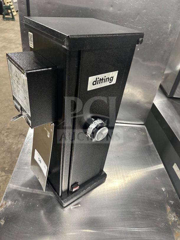 Ditting KR1203 commercial coffee grinder, black, 120V, 1 phase. Model and serial number labels visible. Excellent condition.