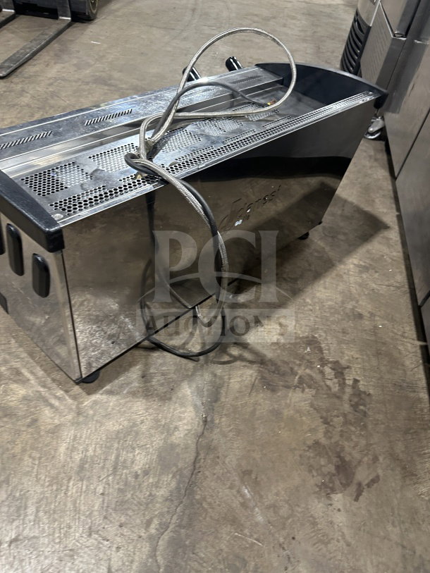 Danesi commercial stainless steel 3-group espresso machine with porta filter handles, good condition, countertop model.