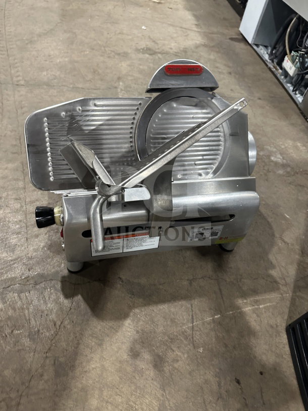 Tor-Rey RB-300A electric deli meat slicer on legs, commercial grade, 115V, sleek metal design, serial number 00201470.