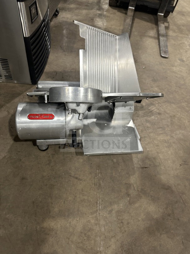 Rare Tor-Rey RB-300A commercial deli meat slicer, electric-powered, silver, on legs, visible Tor-Rey logo, good condition.