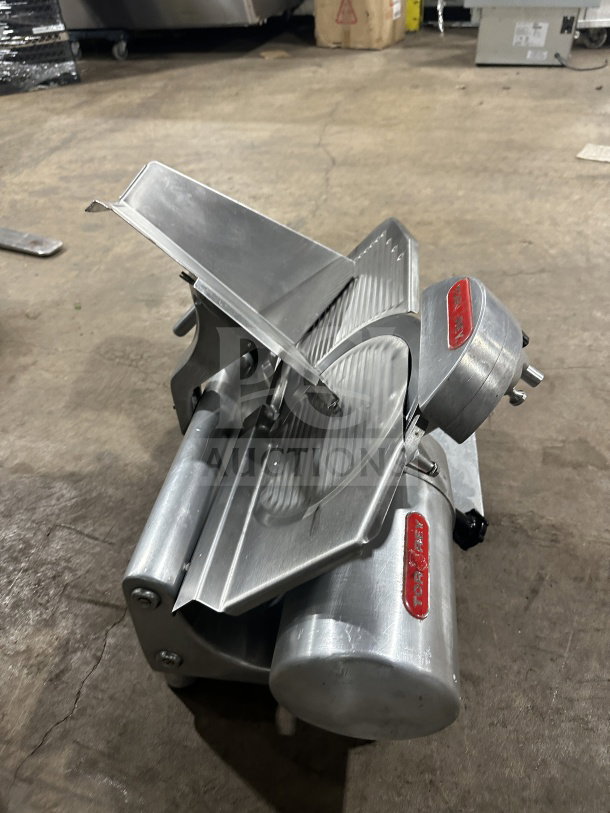 Tor-Rey RB-300A electric deli meat slicer on legs, model SN:00201470, in used condition, featuring stainless steel blade.