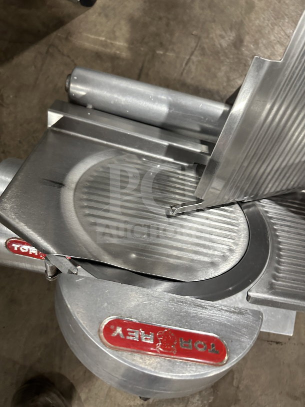 Tor-Rey RB-300A electric deli meat slicer, model RB300A, SN: 00201470, 115V, on legs, features stainless steel blade.