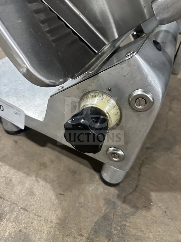 Tor-Rey RB-300A deli meat slicer, electric-powered, with precision dial, sturdy metal construction, and leg supports.