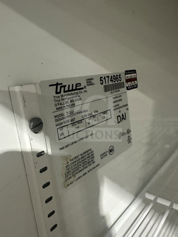 True T-23F single door stainless steel freezer, Energy Star certified, model SN: 5174965, 115V, on casters, with poly-coated wired rack.