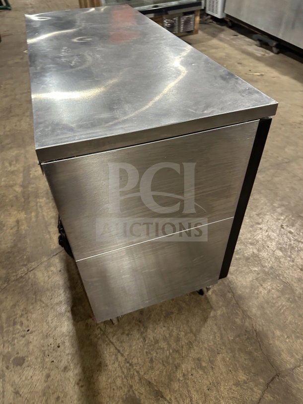 Perlick BBS60RM commercial black 2-door back bar cooler with stainless steel worktop, poly-coated wire racks, on casters.