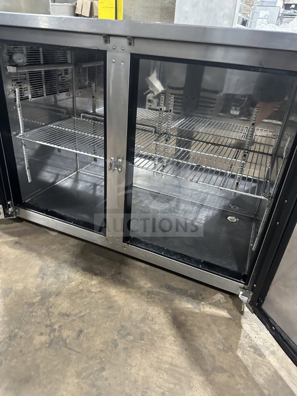 Perlick BBS60-RM back bar cooler with stainless steel worktop, black exterior, poly-coated wire racks, on casters, 115V.