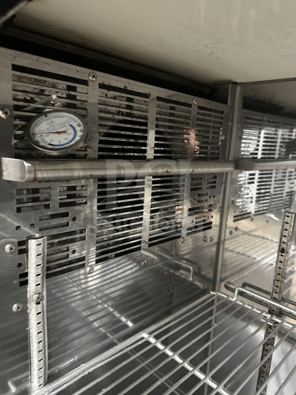 Perlick BBS60RM 2-Door Black Back Bar Cooler, stainless steel worktop, poly-coated wire racks, on casters, SN: 713288.