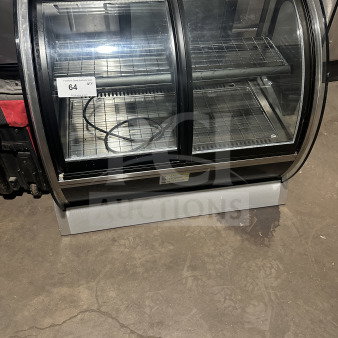 Vollrath RDE8363 countertop refrigerated display case with curved front glass, stainless steel body, dual access doors.