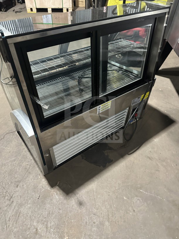 Vollrath RDE8363 refrigerated display case with curved glass, stainless steel body, front and rear access. Model: RDE8363.
