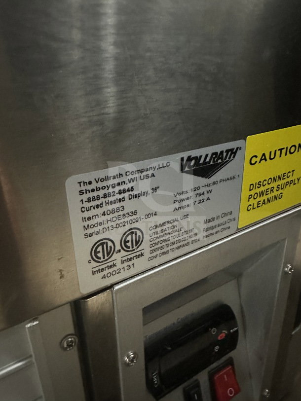 Vollrath RDE8363 refrigerated display case, stainless steel, curved glass, dual-access doors, 120V, serial D13-00210091-0014.