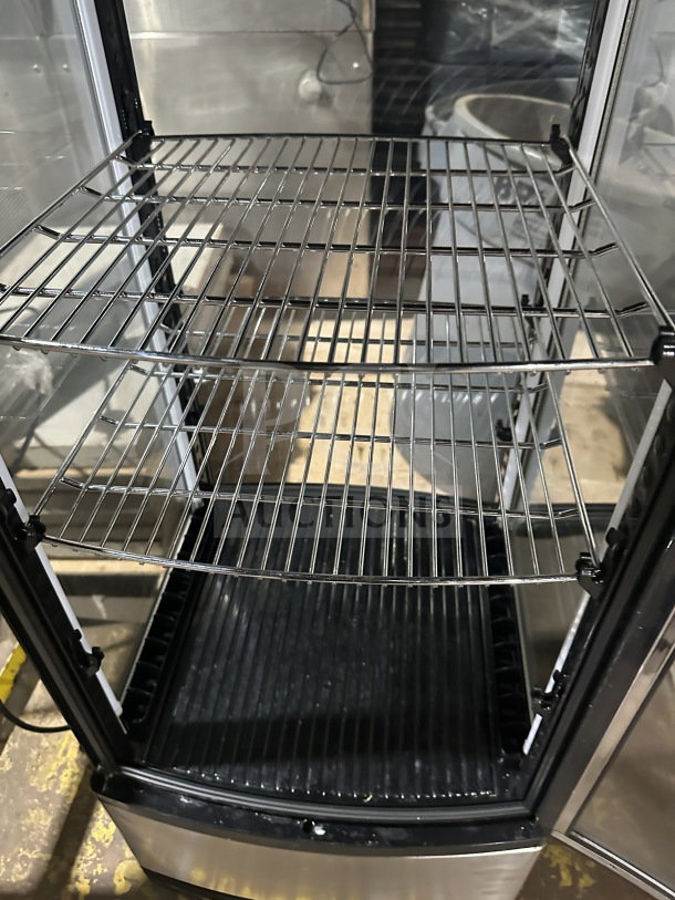 Berg RT78L refrigerated display merchandiser, glass door, chrome-plated wire rack, clean condition, ideal for beverages.