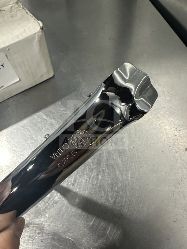 Brand new AmericanMetalCraft pan gripper, model 9525, shiny metal finish, marked with "9525" and "China".